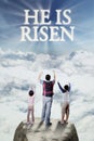 Cheerful family looking at text he is risen Royalty Free Stock Photo