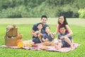 Cheerful family picnicking together in the park Royalty Free Stock Photo