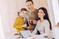 Cheerful family posing while having breakfast