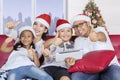 Cheerful family with Santa hat show thumbs up Royalty Free Stock Photo