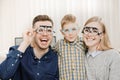 Cheerful family with small child reception doctor ophthalmologist using glasses Royalty Free Stock Photo