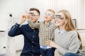 Cheerful family with small child reception doctor ophthalmologist using glasses Royalty Free Stock Photo