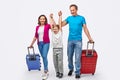 Cheerful family with suitcases ready for trip Royalty Free Stock Photo