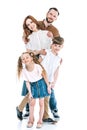 cheerful family with two kids standing together and smiling at camera Royalty Free Stock Photo