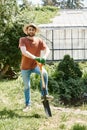 cheerful farmer with beard wearing sun