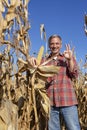 Cheerful Farmer with Ripe Corncob Showing Ok Hand Sign
