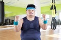 Cheerful fat man in fitness center Royalty Free Stock Photo