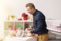 Father changing baby girl diapers Royalty Free Stock Photo