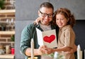 Cheerful father and daughter celebrating Fathers Day together at home Royalty Free Stock Photo