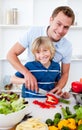 Cheerful father and his son cooking Royalty Free Stock Photo