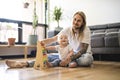 Cheerful father playing with his baby girl on floor at living room Royalty Free Stock Photo