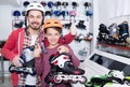 Cheerful father and son boasting roller-skates