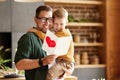 Cheerful father and son celebrating Fathers Day together at home Royalty Free Stock Photo