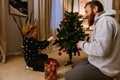 Cheerful father and son decorating Christmas tree at home Royalty Free Stock Photo