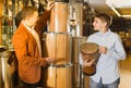 Cheerful father and son examining ethnic drums