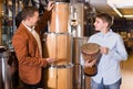 Cheerful father and son examining ethnic drums