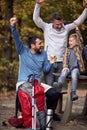 Cheerful father, son and grandson are happy together in the forest Royalty Free Stock Photo