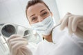 Cheerful female dental doctor is working in her Royalty Free Stock Photo