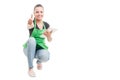 Cheerful female employee with tablet thumb up