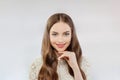 Cheerful female face. Close up portrait of nice beautiful woman with shiny healthy brown hair and natural makeup on white