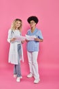 cheerful female oncologists, interracial doctors on Royalty Free Stock Photo