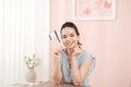 Cheerful Female Packing Suitcase And Getting Ready For Traveling Royalty Free Stock Photo