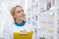 Cheerful female pharmacist working at the drugstore Royalty Free Stock Photo