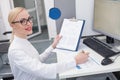 Cheerful female researcher is making some notes Royalty Free Stock Photo