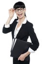 Cheerful female secretary carrying business files Royalty Free Stock Photo