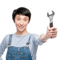 Cheerful female worker holding wrench Royalty Free Stock Photo