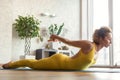 Cheerful female yogi exercising in morning