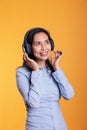 Cheerful filipino woman listening music and dancing Royalty Free Stock Photo