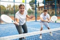 Young girl paddle tennis player performing forehand