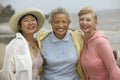 Cheerful Friends Enjoying Vacation At Beach