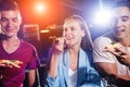 Cheerful friends in the pub. Drinking beer, eating pizza, talking, having fun. Royalty Free Stock Photo