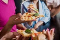 Cheerful friends in the pub. Drinking beer, eating pizza, talking, having fun. Royalty Free Stock Photo