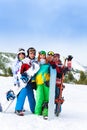 Cheerful friends standing with snowboards Royalty Free Stock Photo