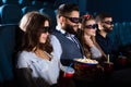 Cheerful friends together at the movie theatre Royalty Free Stock Photo