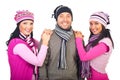 Cheerful friends in woolen caps and scarves