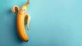 cheerful funny banana on blue background with copy space