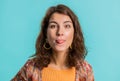 Cheerful funny bully young woman showing tongue making silly faces, fooling around, joking, teasing Royalty Free Stock Photo