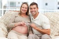 Cheerful future parents holding a sonogram Royalty Free Stock Photo
