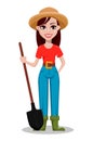 Cheerful gardener woman rancher holding a shovel.