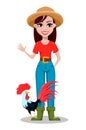 Cheerful gardener woman rancher waving hand and standing near rooster.