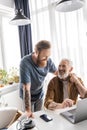 Cheerful gay couple holding hands near Royalty Free Stock Photo