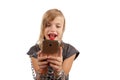 Cheerful girl addicted to smartphone shackled with chains