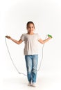 Cheerful girl in casual clothes jumping on rope Royalty Free Stock Photo