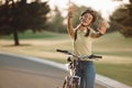 Cheerful girl cyclist gesturing with hands outdoors. Royalty Free Stock Photo