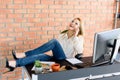 Cheerful girl enjoying her work in office Royalty Free Stock Photo