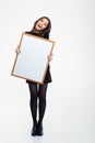 Cheerful girl holding blank board Royalty Free Stock Photo